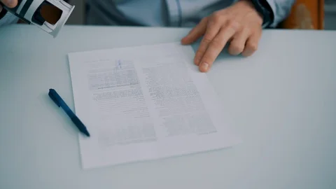 The man puts a seal on the document Stock Footage 129168009