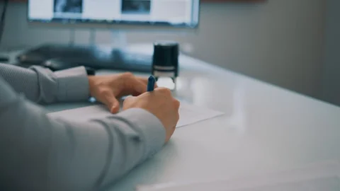 The man puts a seal on the document Stock Footage 129183468