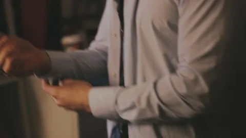 Man puts on a shirt close-up Stock-Footage 76510073