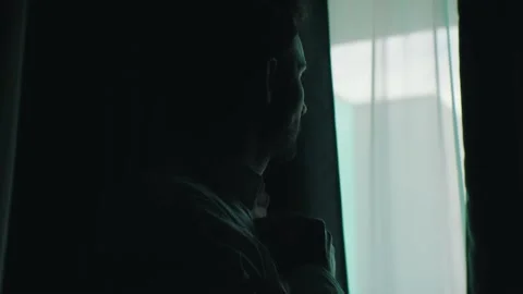 A man puts on a shirt for work Stock-Footage 131399088