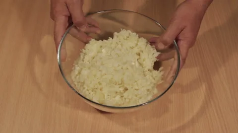 Man puts shredded potatoes on the table Stock Footage 68504830