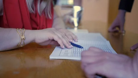 A man puts a signature in the document Stock Footage 94569857