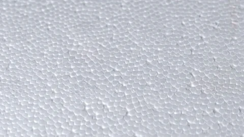 Man puts a stamp on the foam box, stamp in the form of a skull with bones, which Stock Footage 104611335