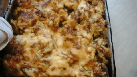 A man puts on the table baked potatoes with meat Stock Footage 85590169