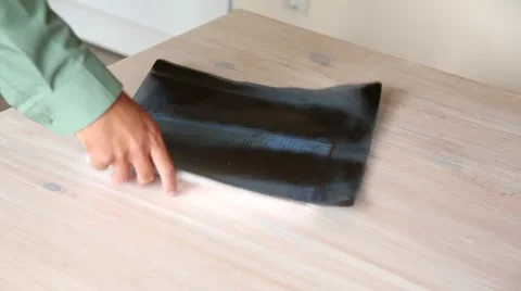 The man puts on the table an x-ray and documents. Stock Footage 62559387