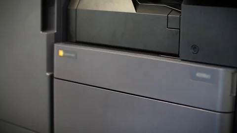 Man puts toner in the printer YCMK Stock Footage 74007798