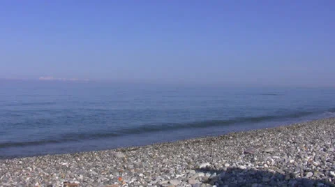The man puts an umbrella on a beach Stock Footage 26349991