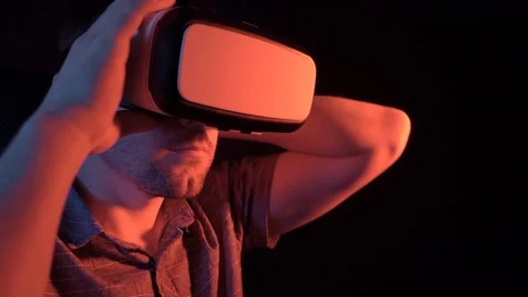 A man puts on virtual reality glasses. 4k video Stock Footage 115089579