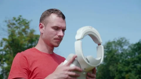 Man puts a virtual reality helmet on his head and controls gestures Stock Footage 131616116