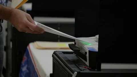 Man Puts Voting Form In Scanning Machine - Vote Stock Footage 97485639