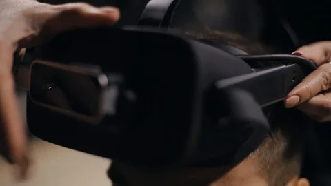 Man puts VR glasses on close-up Stock Footage 112151310