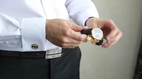 Man Puts On Watch Stock Footage 56925883