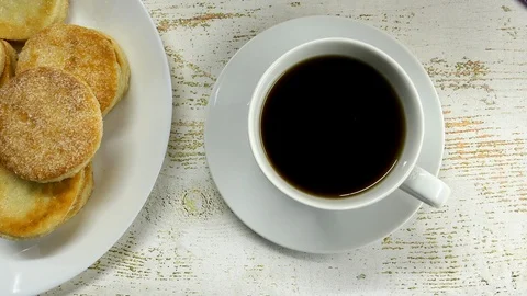 The Man Puts A White Cup Of Tea And A Saucer On The Table. On Table Dish Of Home Stock Footage 121343123