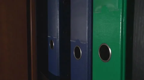 Man Putting Back A File Into A Shelf Side-Shot Stock Footage 36035260