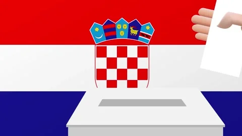Man putting ballot in a box during elections in Croatia in front of flag. Stock Footage 283533348