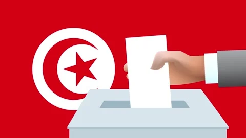 Man putting ballot in a box during elections in Tunisia in front of flag. Video stock 283533376