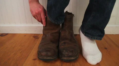 Man putting on boots, close up Stock Footage 34486057