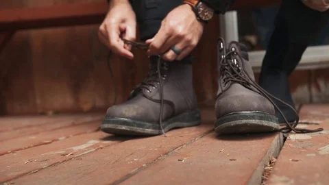 Man Putting On Boots Stock Footage 83598490