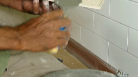 Man putting ceramic tile on the wall. Stock Footage 71129437