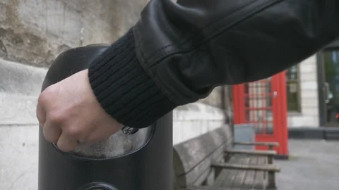 A man putting a cigarette in an ashtray. Stock Footage 107941410