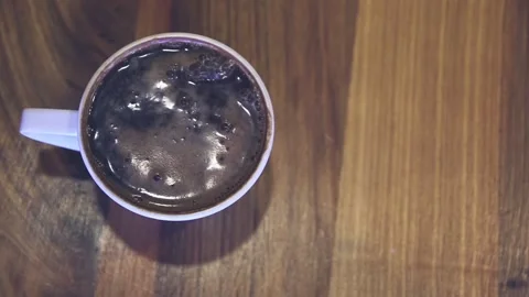 Man is putting coffee on the table Stock Footage 244601350