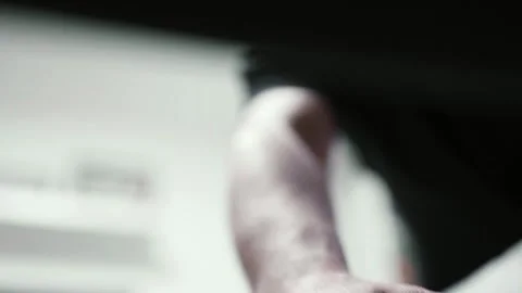 Man putting cotton bedding into under the couch storage place. Small space conce Stock Footage 319334656