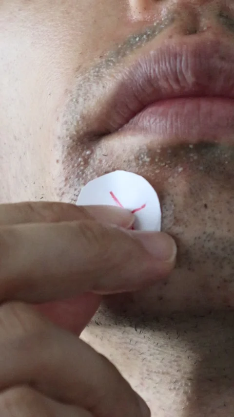 A man putting a cross on his rough skin Stock Footage 326088276
