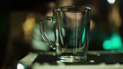 Man putting down the mug with fingerprints, staff is taking the cup. Stock Footage 199222516