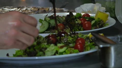 Man putting dressing on a salad  Stock Footage 40976241
