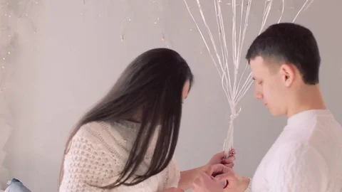 Man putting a engagement ring after proposal isolated on a white background Stock Footage 74025846