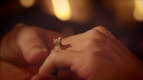 Man Putting On Engagement Ring Slow Motion Stockbeeldmateriaal 120800365