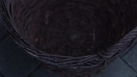 Man putting firewood in a basket Stock Footage 265083088