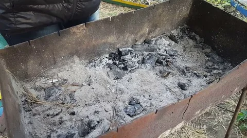 Man is putting the firewood in the brazier Video stock 80427405