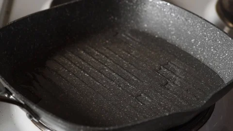 Man putting fresh red meat kebabs in to the frying pan with hot oil to fry them Stock Footage 126777518