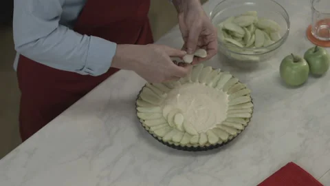 Man Putting Freshness Apple Cut Slices on Cream Stock Footage 164019809