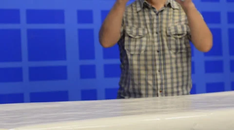 Man putting gift boxes on table in a row Stock Footage 39740658