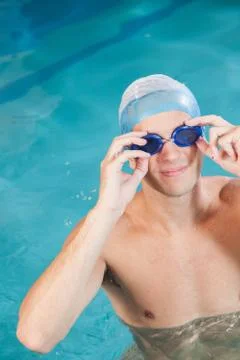 Man putting on goggles Stock Photos