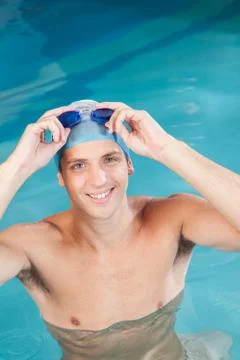 Man putting on goggles 写真素材