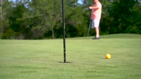 Man putting at golf course green Stock-Footage 135664616