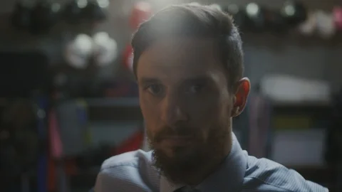 Man putting on jacket Stock Footage 106633989