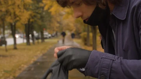 Man putting on latex gloves Stock Footage 141521331