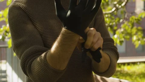 Man putting on latex gloves Stock Footage 142447207