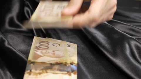 Man putting money on the table and retracting it 4k. Stock Footage 96050997