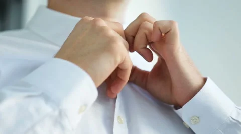 Man putting on neck tie Stock Footage 68627101