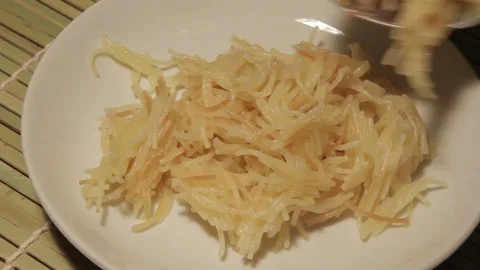 Man putting pasta on to plate. Stock Footage 69722679