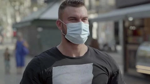 Man putting a protective face mask on Video stock 140105107