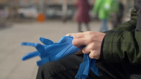 Man putting on protective gloves Stock Footage 126824589