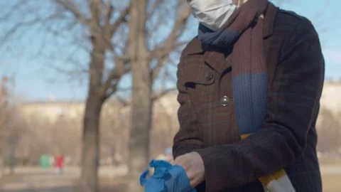 Man putting on protective gloves Stock Footage 127311514