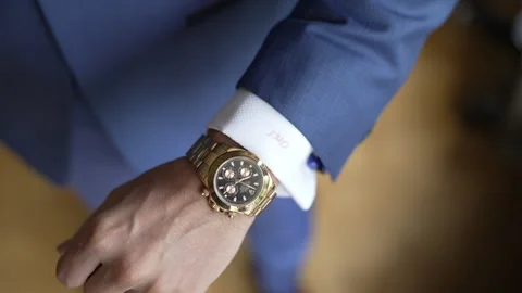 Man putting on Rolex Watch 库存影片 196821556