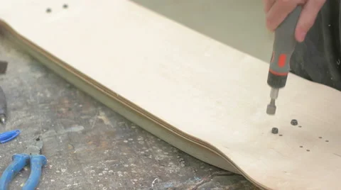 Man putting screws into the wood Stock Footage 58307523